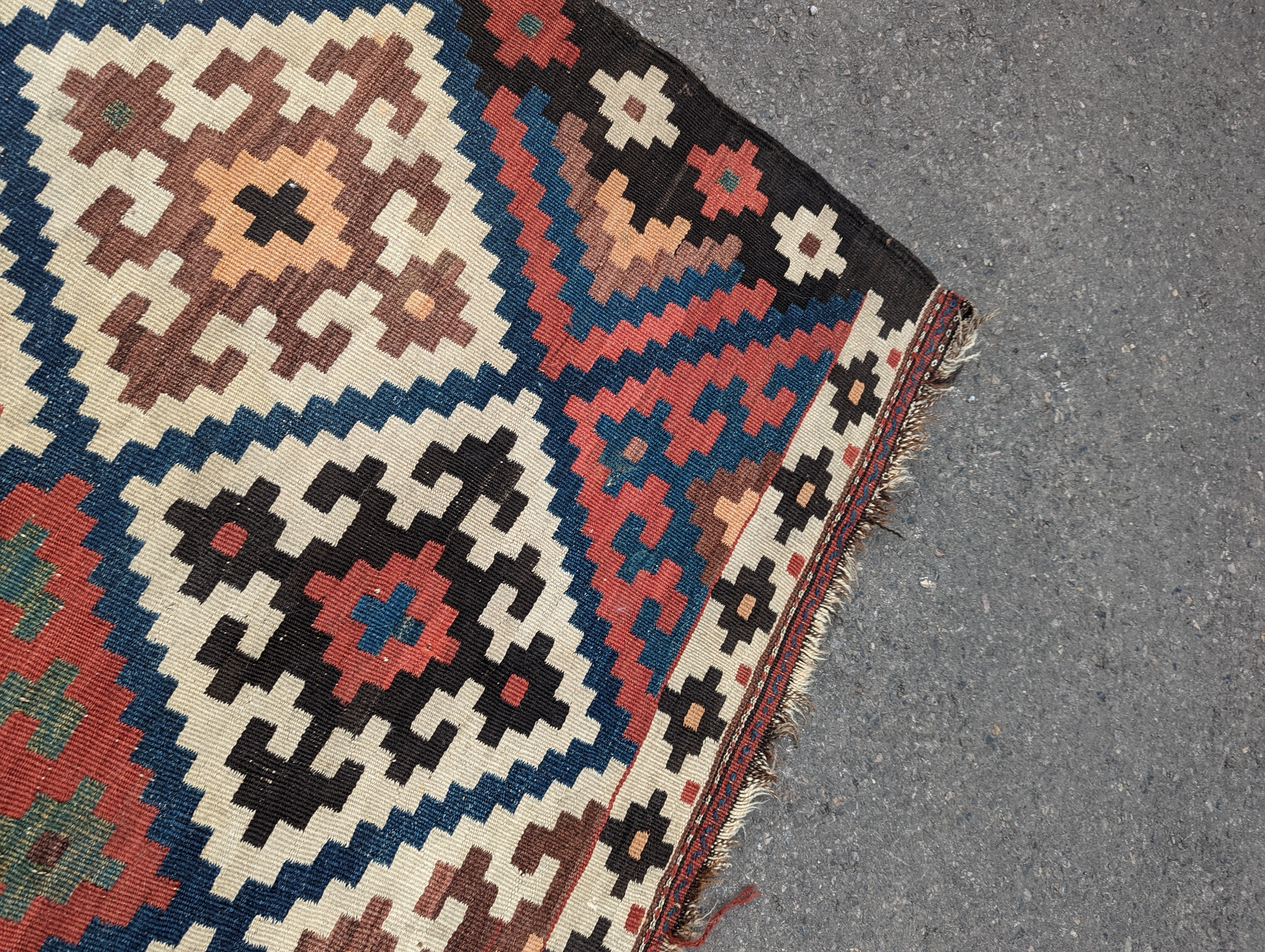 A Persian tribal Kelim carpet, 230 x 158cm and a Turkish bag